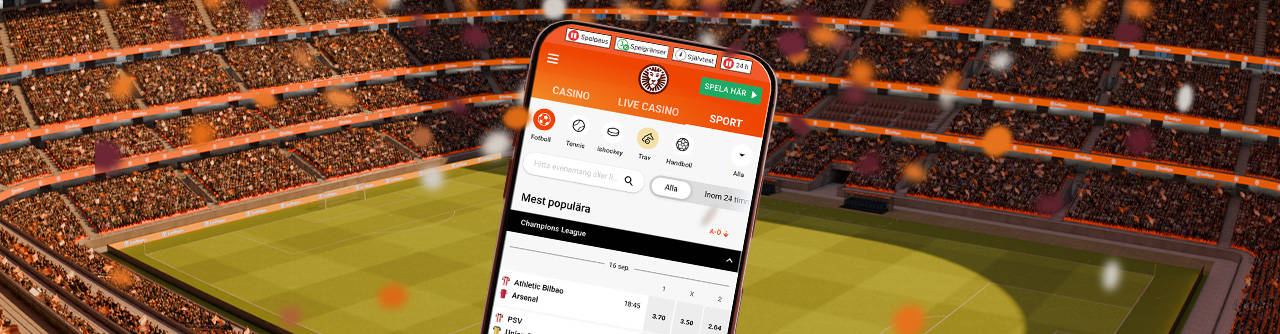 Mobil med sportspel-app i en fullsatt fotbollsarena.
