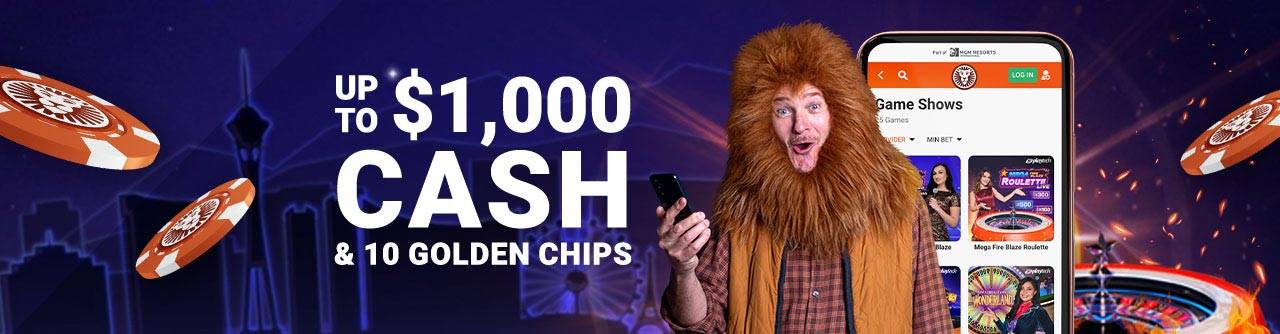 Man in lion headdress points to a phone displaying casino games like roulette and Buffalo Blitz Live.