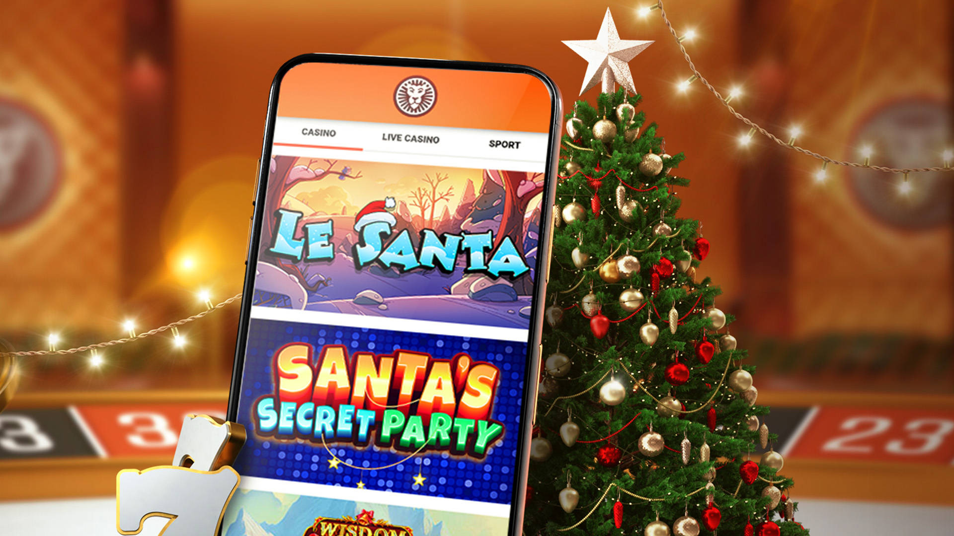 Mobiltelefon med casinospil på skærmen og et juletræ i baggrunden.