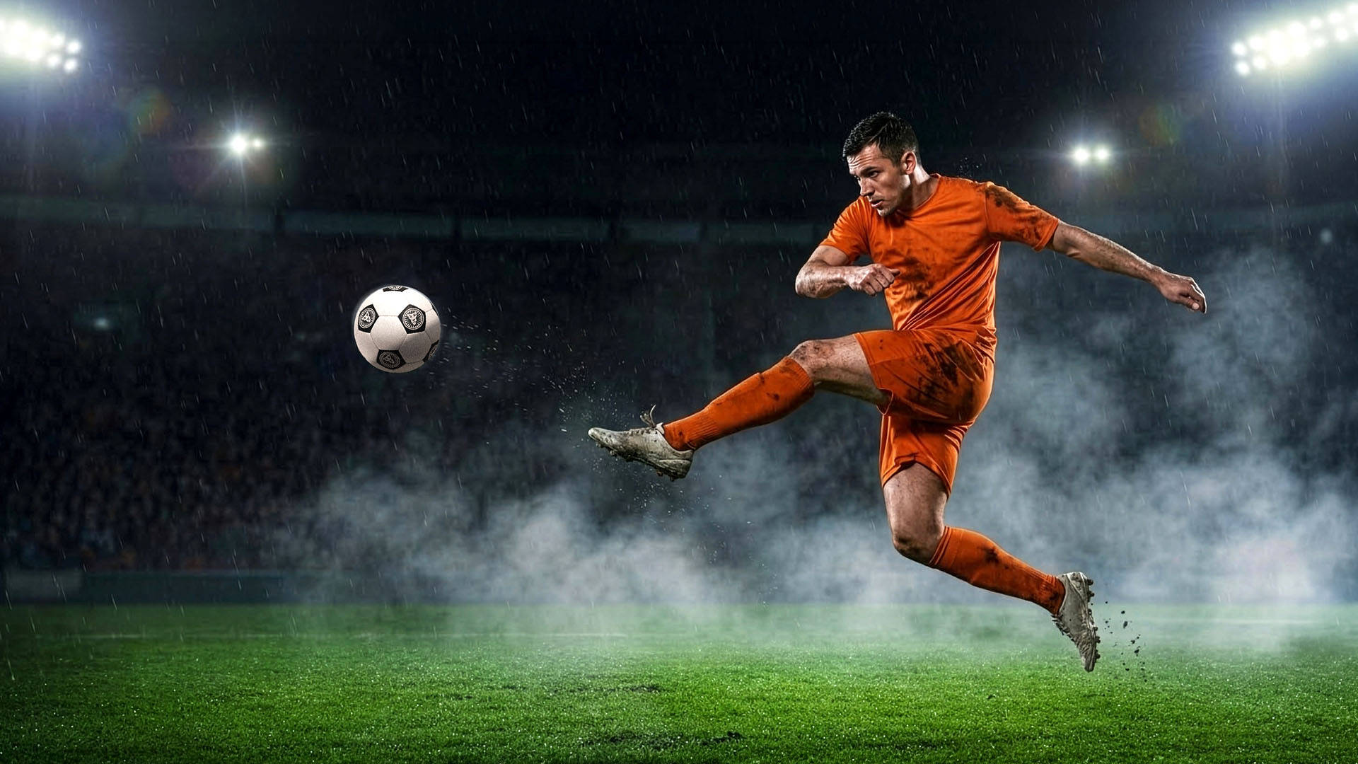 Fußballspieler in Aktion auf dem Spielfeld bei Regen.
