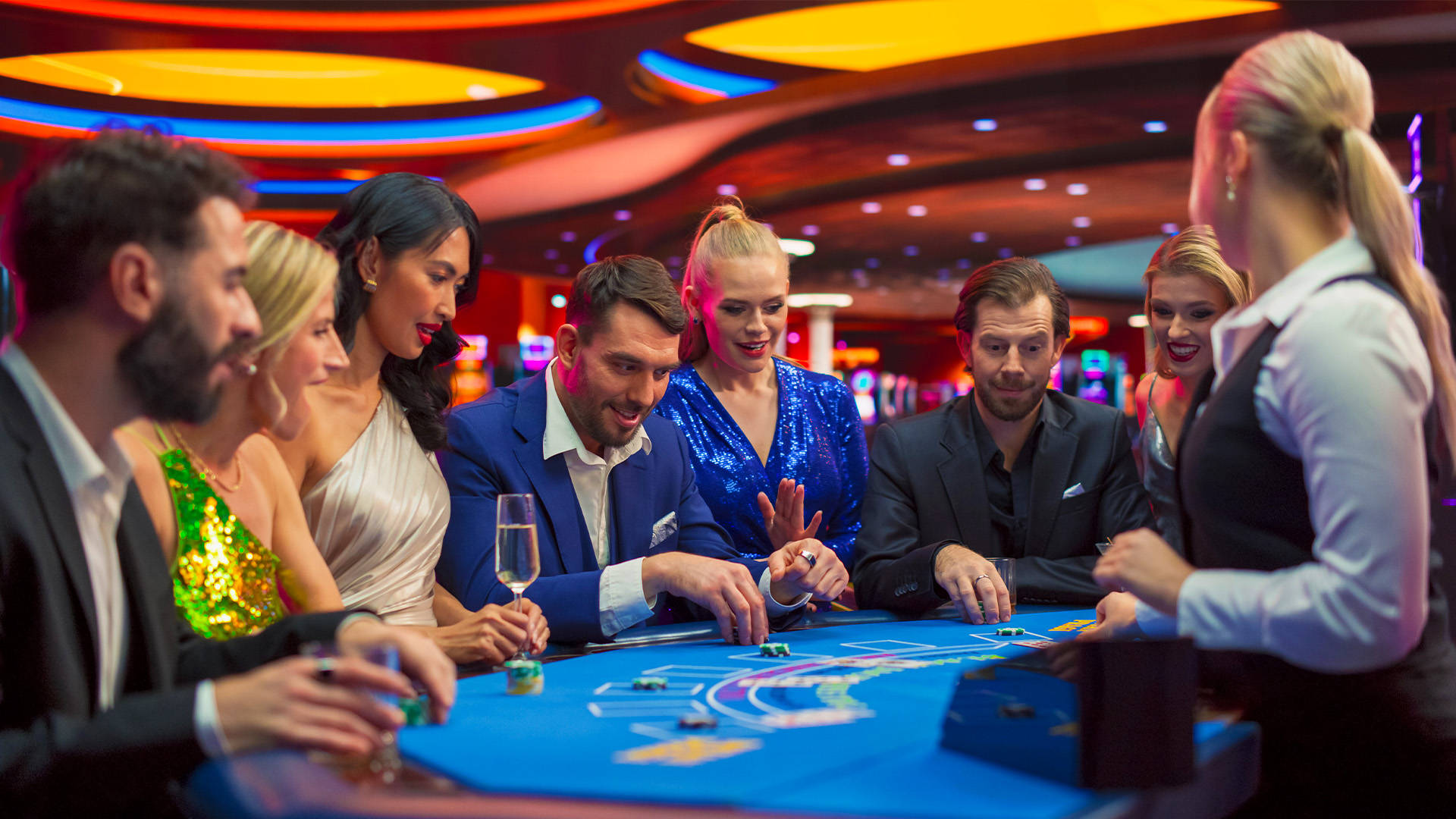 players sitting around a blackjack table