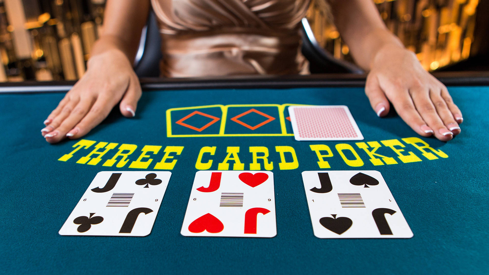 poker table with three cards displayed on it