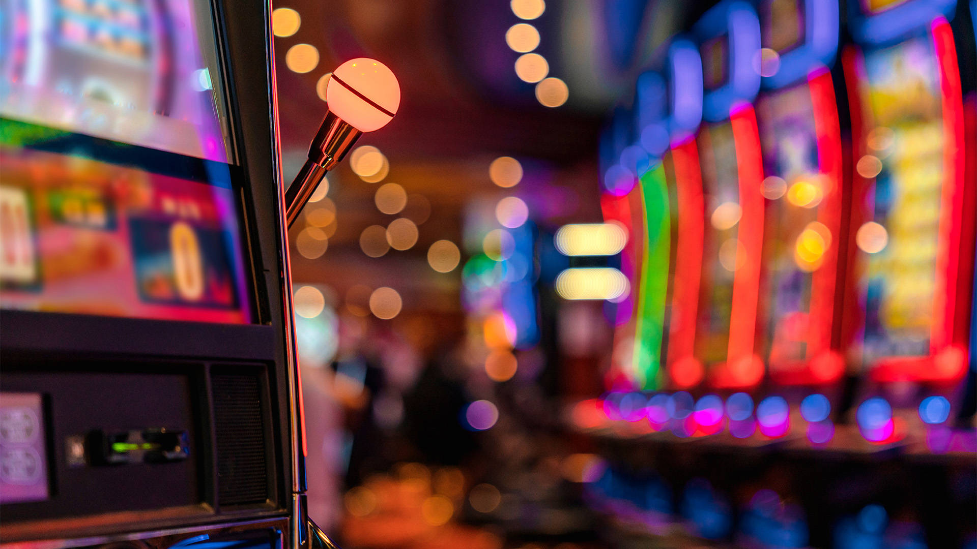 land based slot machine with a row of slots set off in the backdrop
