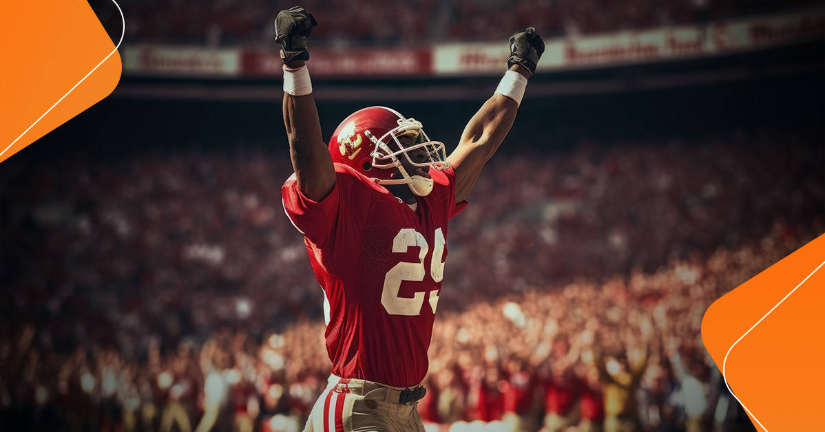 football player celebrating with both arms in the air