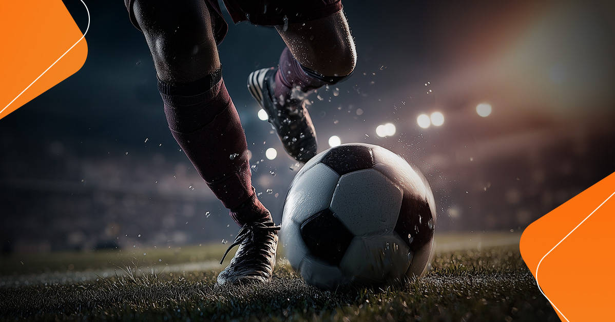 player striking soccer ball