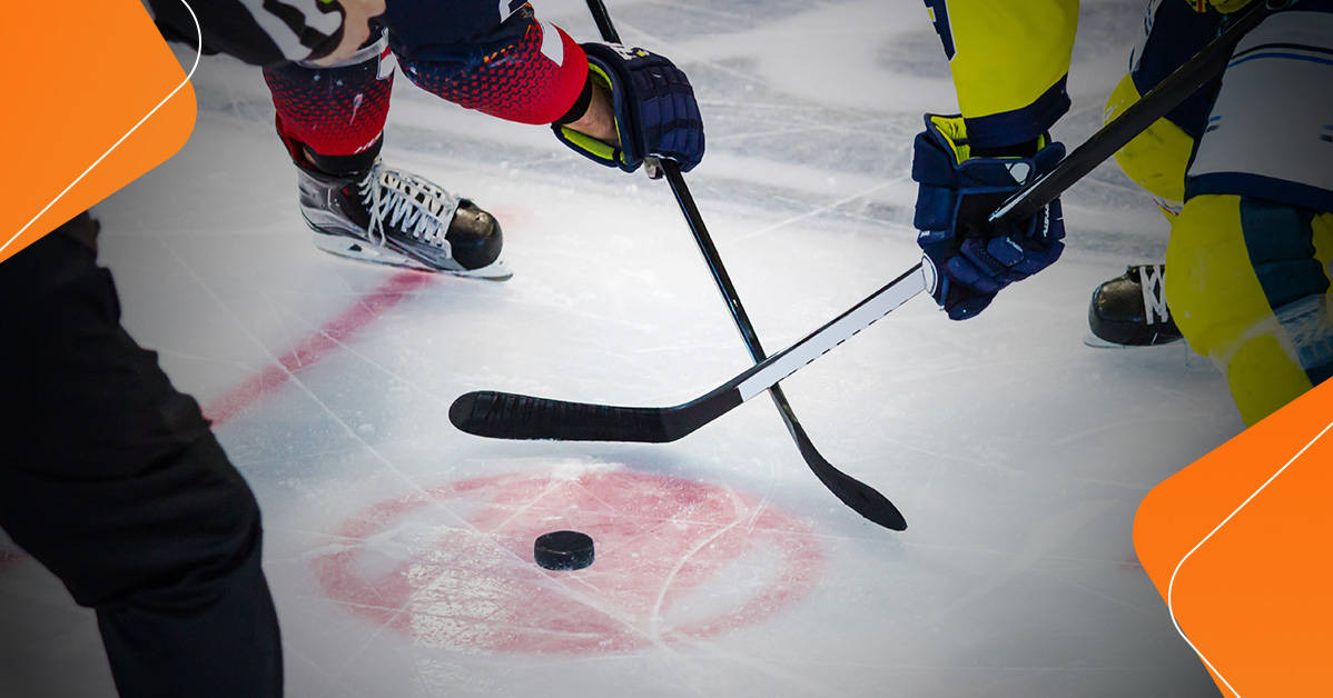 two players colliding with their hockey sticks