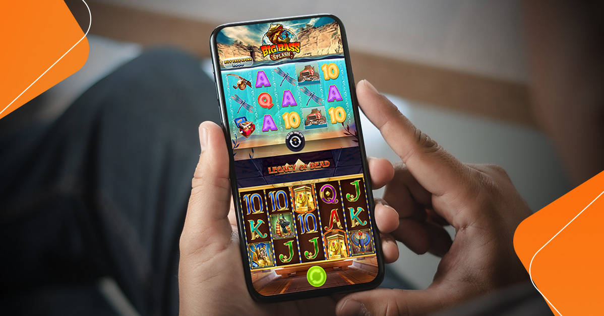 player holding mobile phone with video slots displayed