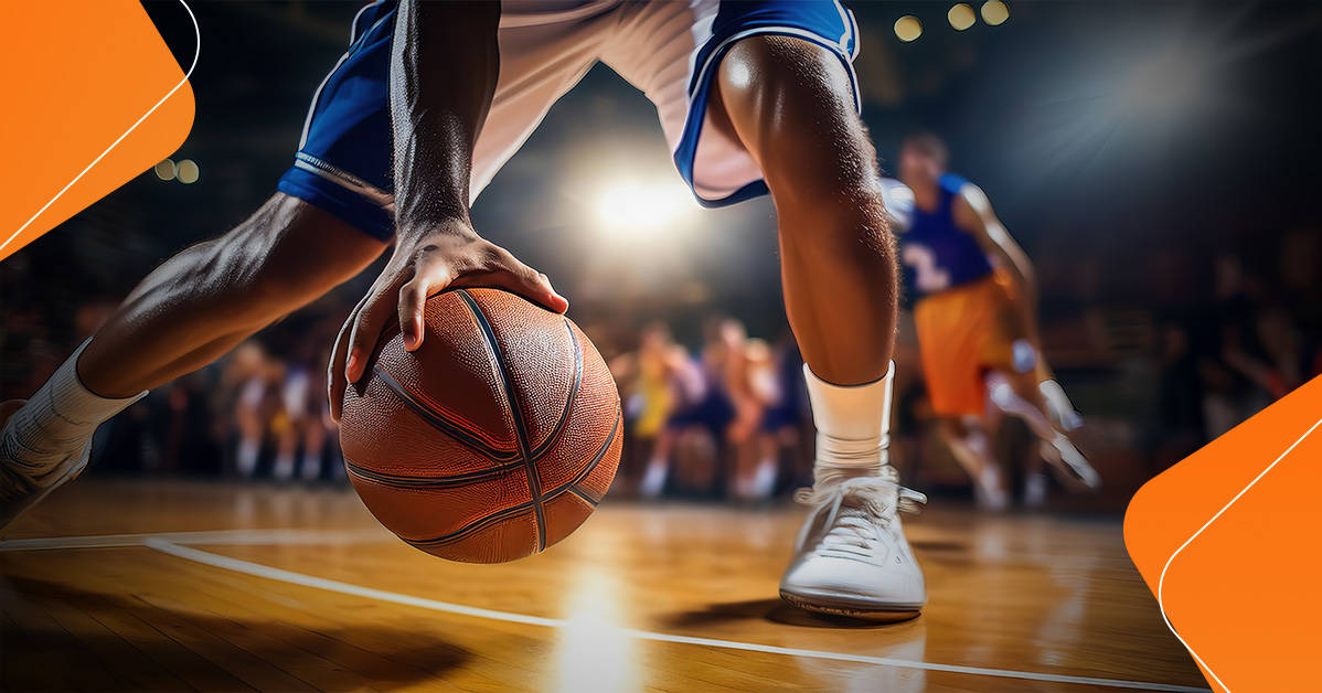 basketball player dribbling ball low to the ground