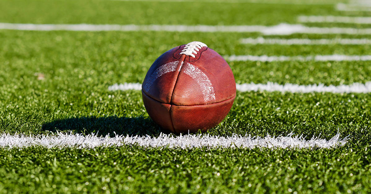 American football placed on the field
