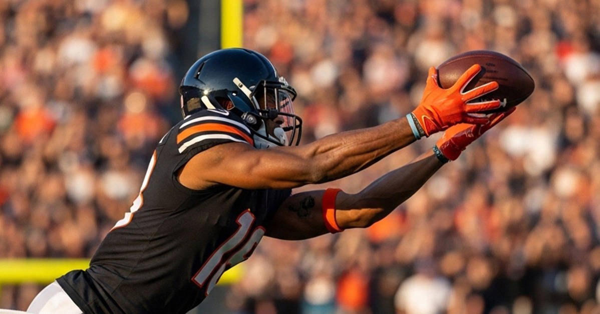 football player diving to catch the football