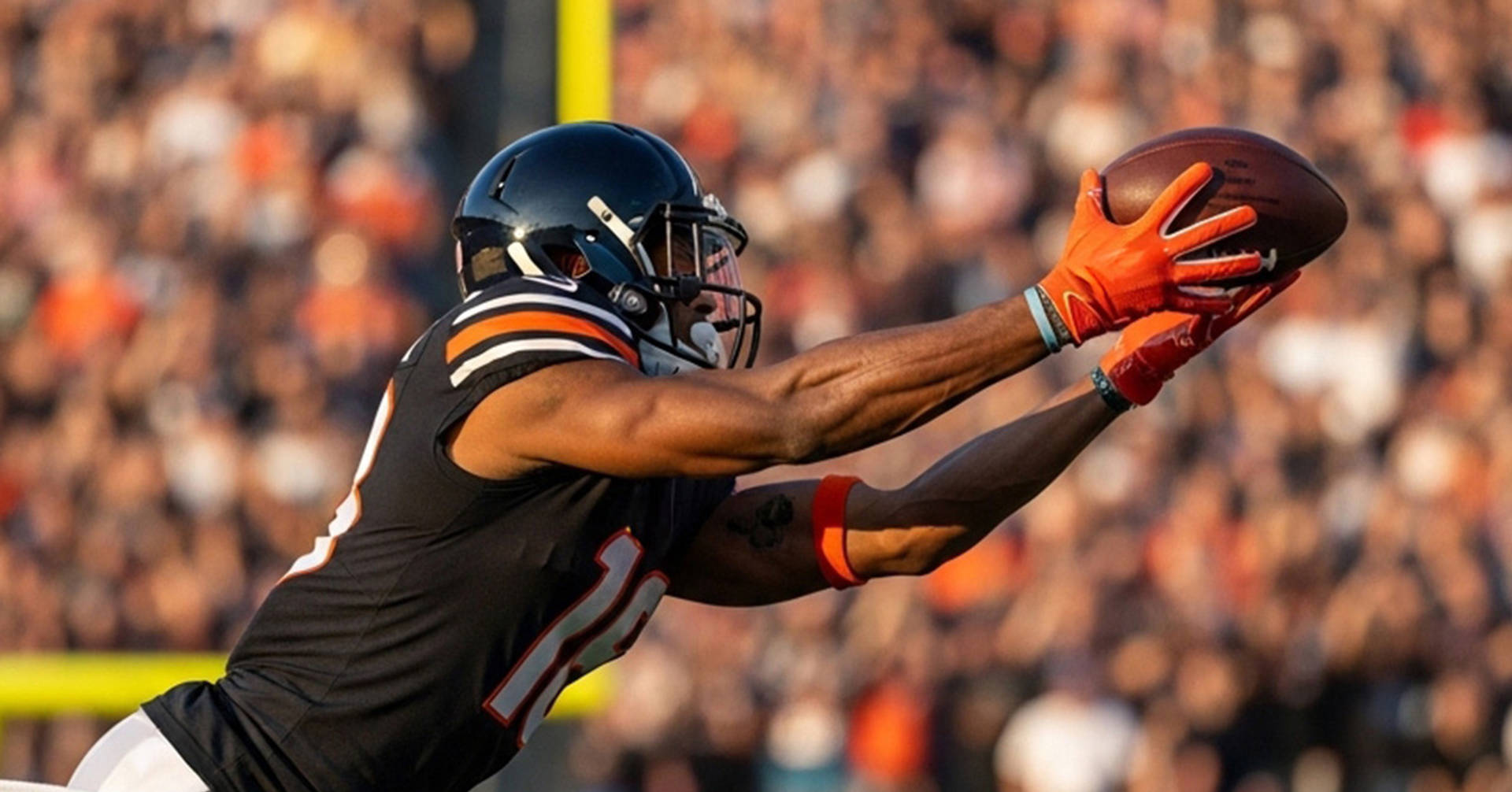 football player diving to catch the football