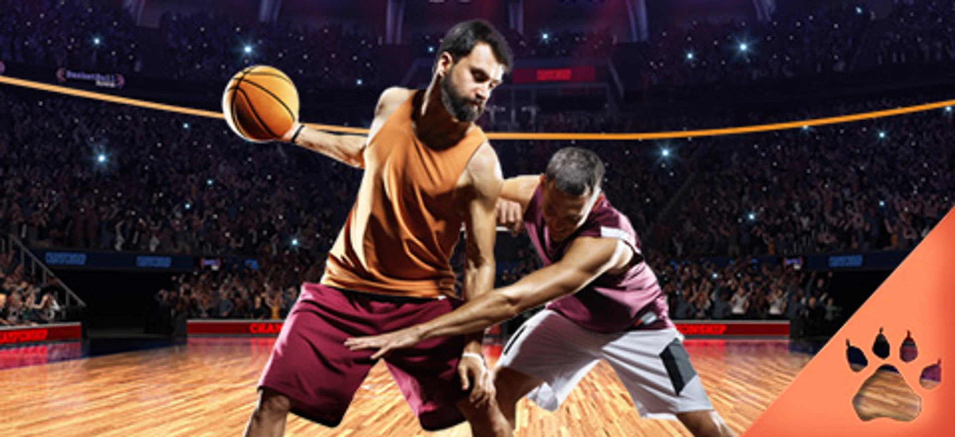 To basketballspillere i aktion under en kamp foran fyldt arena