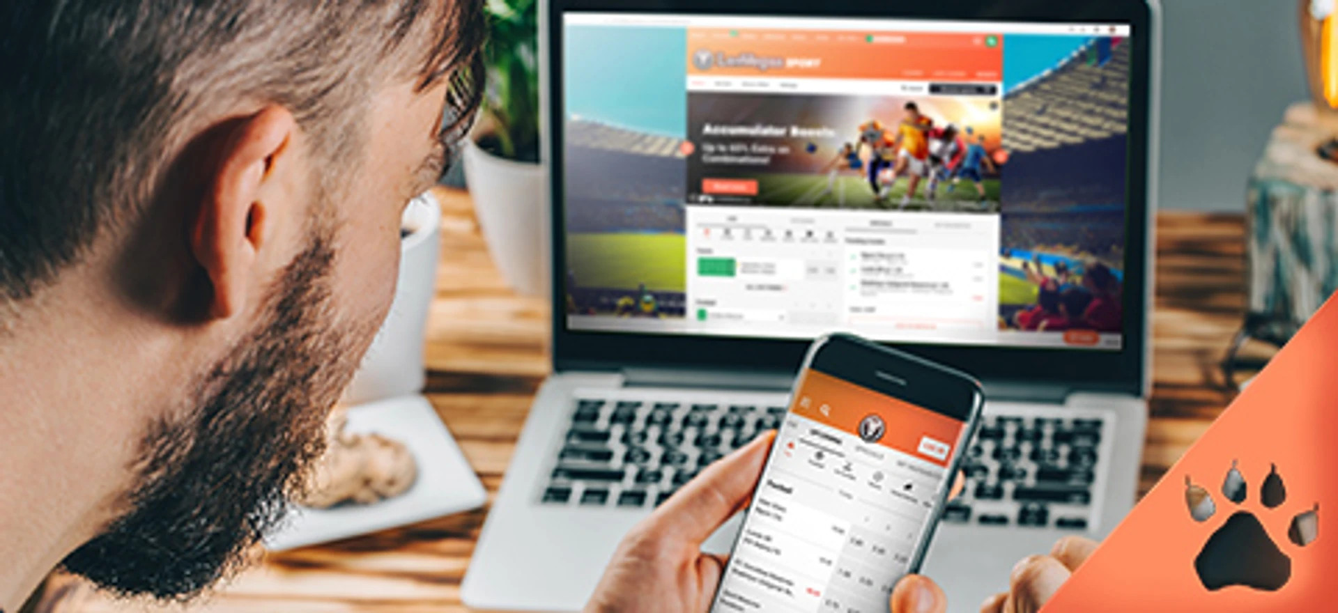 Mand tjekker sportsbetting på LeoVegas via mobil og laptop