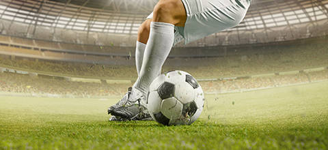 Football player dribbling