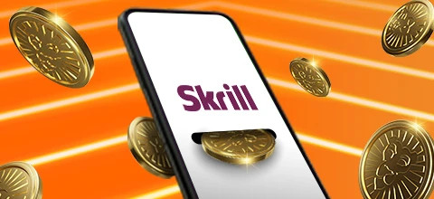 Puhelimen näytöllä näkyy Skrill-logo ja ympärillä on kultaisia kolikoita