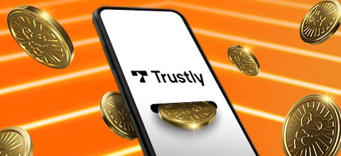 Puhelimen näytöllä näkyy Trustly-logo ja ympärillä on kultaisia kolikoita