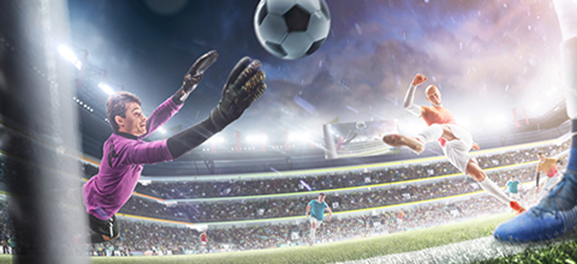 a goalkeeper  dives to save a kick from an attacker in a crowded stadium