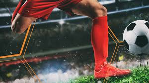 Football Player Kicking a Ball
