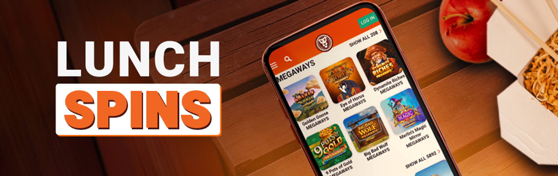 Lunch Spins promotion featuring Megaways games on a mobile phone, alongside an apple and noodles.