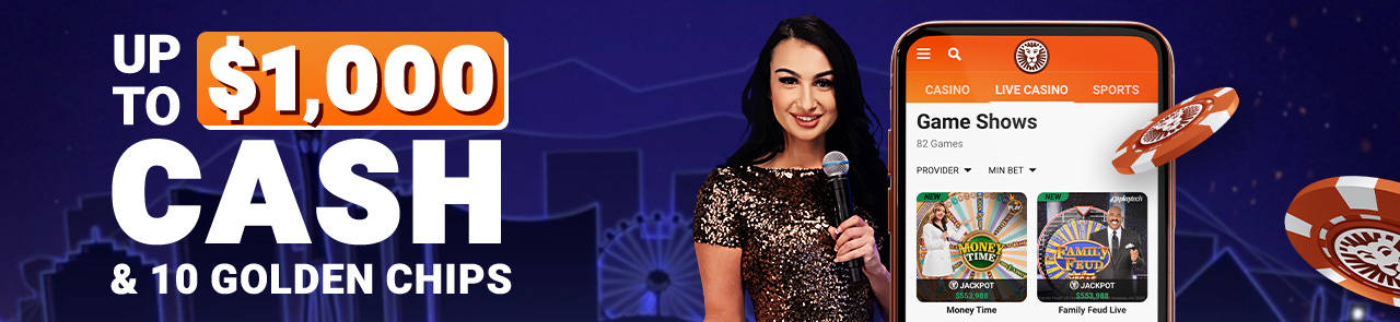 Man in lion headdress points to a phone displaying casino games like roulette and Buffalo Blitz Live.